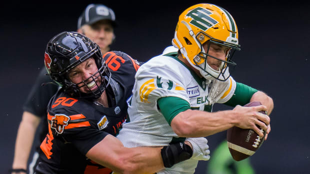 Jun 17, 2023; Vancouver, British Columbia, CAN; BC Lions defensive lineman Mathieu Betts (90) sacks Edmonton Elks quarterback Taylor Cornelius (15) in the second half at BC Place. BC won 22-0. Mandatory Credit: Bob Frid-USA TODAY Sports  